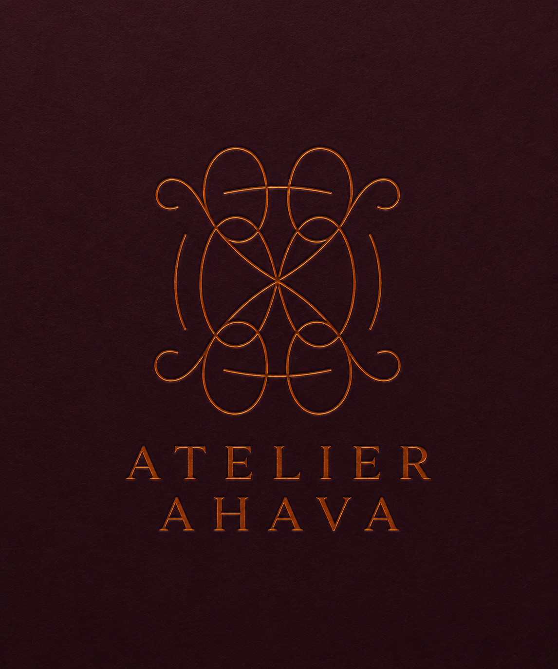 Atelier Ahava monogram in copper foil on burgundy