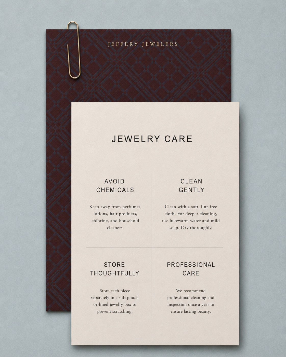 Jeffery Jewelers jewelry care card with burgundy plaid backer