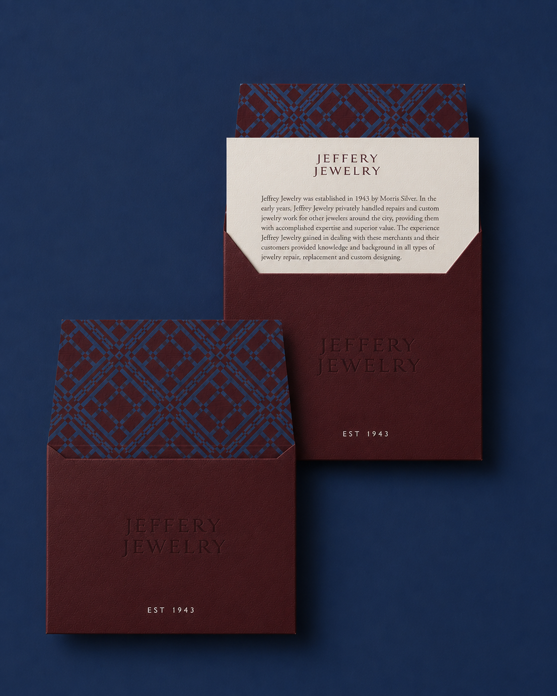 Jeffery Jewelers burgundy envelope with plaid liner and embossed brand story card, est. 1943